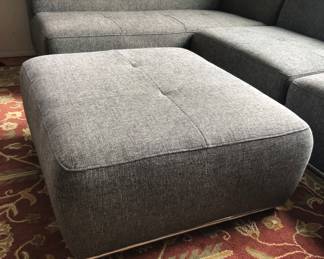 Ottoman (30” x 35” x 15” high) Note silver metal trim at bottom. It’s on the sofa too.