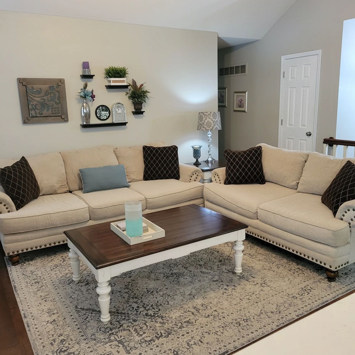 Sofa and loveseat with metal nailheads, coffee table