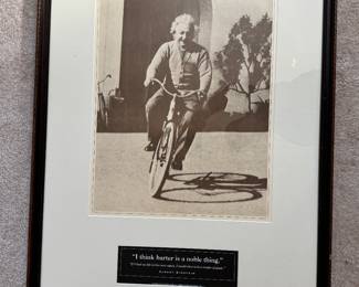 #134 ----	
ARTIST: Unknown
TITLE:	Einstein on a Bike
MEDIUM:	Framed poster with quote.
EDITION:	n/a
FRAMED SIZE: 38"H x 26"W
COA: No
