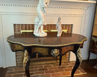 In the style of André-Charles Boulle Mounted And Inlaid Center Table (51"W x 30"H x 32"D)