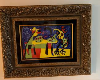 #77 ----	
ARTIST: Joan Miro
TITLE:	Le Chien Aboyat A La Lune Ref; M.189
MEDIUM:	Framed original lithograph in colors on thick wove paper. Signed by the aritst on the stone.
EDITION:	First Edition. Printed by Mourlot Freres of Paris, 1952. Rare and Important. 
CANVAS SIZE: 355mm x 530mm
COA: Yes