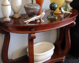 Large half round table full of goodies 