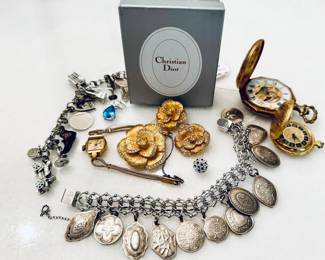 Sterling Charm bracelets, Vintage Christian Dior earring/pin set with original box, 14 kt gold watch, topaz charms, diamond and saphire charm....