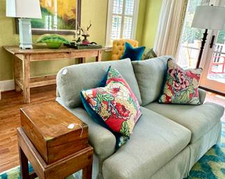 Kellogg Collection loveseat, pine table, Original art by Lisa Povanff, vintage writing desk on stand, Thibaut pillows, blown glass vase