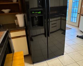 Black LG Side by Side Refrigerator/Freezer. In Door Water/Ice.