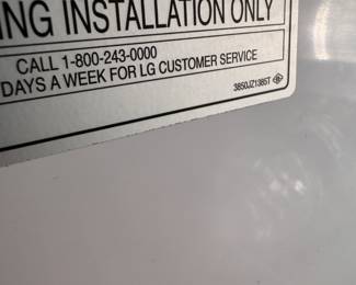 Black LG Side by Side Refrigerator/Freezer. In Door Water/Ice.