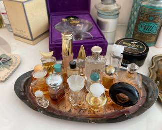 Wide Variety of Perfume bottles some empty some with perfume 