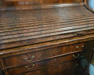 Approximately 1850's I was told. Not your regular roll top in oak, this is a high quality piece.