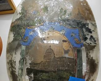 Reverse painted glass piece. Of the Capitol and the statue of liberty.