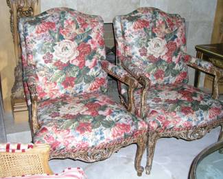 Pair of French Fauteuil Chairs. Arched crest, padded arms, scrolling hand rests, pierced carved apron and scrolling carved legs. Excellent condition. Asking $225 each.