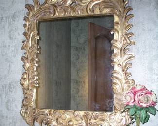 Vintage Italian Baroque Giltwood Mirror. Ornately crafted with large foliate fronds, plaster gilt. Excellent condition. Asking $595.
