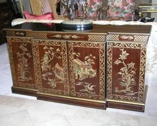 Vintage Chinese Lacquered Breakfront Display Cabinet. Exterior decorated with gold enamel pagoda and tree scenes. Center cabinet has mirrored interior and two glass shelves. Two side cabinets. 60"x20"x20.5". Excellent condition. Asking $475.