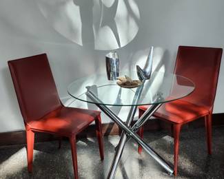 Frag handmade leather chairs from Italy. There are 6 of them.