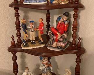 corner curio shelf and figurines
