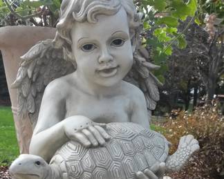 Cherub with Turtle garden statue.