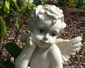Cherub garden statue with doves.