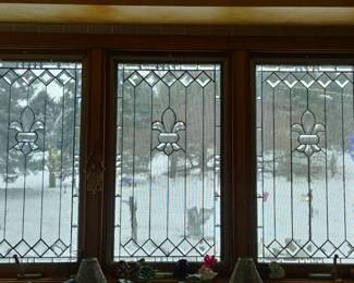 Antique leaded glass window inserts.
Bevels, and fleur de lis focal point design incorporating classic German Antique privacy glass background.
Excellent condition.  No known chips, cracks or flaws detected.
Various sizes available.
Casement window Measurements:  34"  x 18"
Half Door Measurements:  35 1/4"  X  21 1/4"  
Double Hung Measurements:  Each top and bottom panel measures 27" x 23".  
