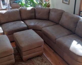 Aniline leather sectional with matching ottomans.  3 sections each measuring apx 60" x 39".  Decorative nice nail heads.  Only the highest quality Full Grain Leather can receive an Aniline Finish.  Good used condition.  Very comfortable.  Smoke Free Home.