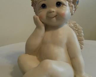 Petite cherub garden statue.