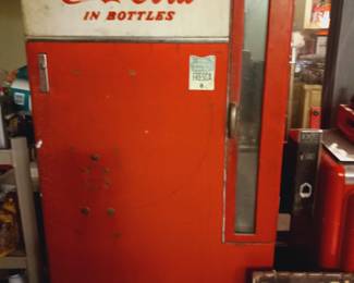 Vintage Coca Cola pop bottle soda machine.