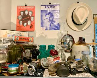 Bullet Box, Blue Ball Jars with glass lids, Western Pottery Jug, Fishing Reels, Lantern, Sheet Music. Etc..