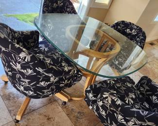 Dining/Game Glass Table with Four Covered Roller Chairs. Nice! 