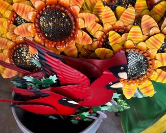 This is a bucket full of yard accessories! Large Sunflower, Small sunflowers and Christmas Cardinals! 