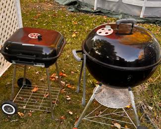 Two nice charcoal grills! The one on the right is a WEBER! 