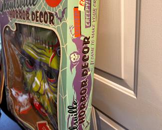 This is an absolutely SUPERB GHOULSVILLE RETRO-A-GO-GO! Vintage Blow Mold Frankenstein Head NEAR MINT in the original box! Designed by Doug P'Gosh
Measures approx. 17" x 22" 