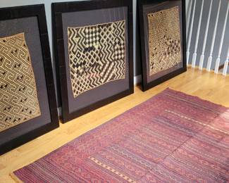 Custom framed Kuba Cloth.
Kuba textiles are a type of raffia cloth unique to the Democratic Republic of the Congo, formerly Zaire, and noted for their elaboration and complexity of design and surface decoration.
Whether worn as a skirt or hanging on a museum wall, Kuba cloth is usually identified by bold, graphic black patterns that suggest movement. The textile often prominently features both repeated themes and irregularities between sections, which remind you that an artist's hand crafted each stitch.