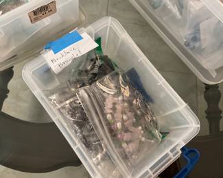 Bin of necklace bracelet sets