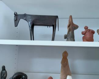 Objects, metal cow, small clay sculpture 
