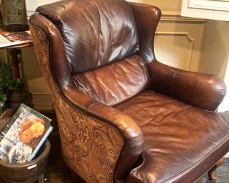 Brown leather wingback chair