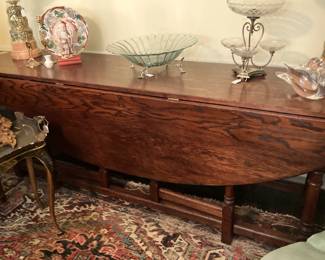 Oval drop-leaf dining table