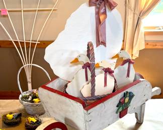 Wooden ducks with wheelbarrow