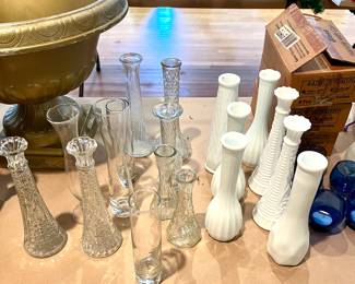 Dozens of flower vases for centerpieces