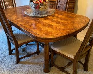 Dining room table with six chairs and two leaves