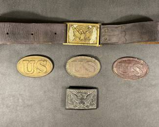 Civil War buckles: US Army Eagle officer’s sword plate buckles, one with original belt.  US Civil War buckles, one with arrow hooks, one puppy paw, one without hooks.  