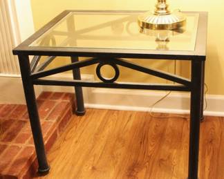 Glass top, iron base end table. $75.00.                                   22" D x 27" W x 22 1/2" H.
