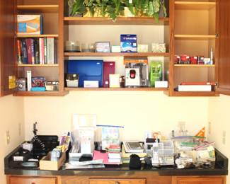 This desk area is filled with practical useful office type items.  Many new in box items.  
