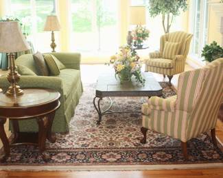 The area rug and flower arrangement shown is not for sale.  Everything else is priced very reasonably.  