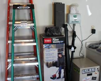 8' and 6' fiberglass ladders, 12" Toro electric snow shovel, 2 drawer file cabinet.