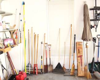Misc. shovels, rakes, patio umbrella and garden equip.