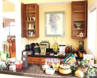 Bar area is packed with bar items, glassware, candles, Longaberger baskets and more.