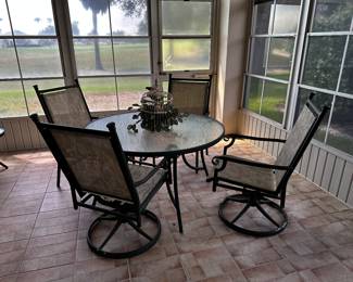 Patio Table with 4 chairs. 2 chairs rock