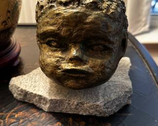 Baby face sculpture 