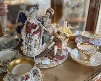 Porcelain figurines and tea cups