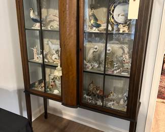 Glass front cabinet with various collections