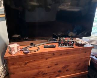 One of several televisions; cedar chest