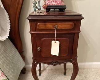 One of pair of cabinet table